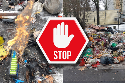 Brennende Batterien zwischen Restmüll auf einer Straße.